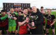 3 March 2020; CFAI Chairman Joe O'Brien presents the trophy to IT Carlow captain Jason Murphy and his team-mates following the Rustlers CFAI Cup Final match between IT Sligo and IT Carlow at Athlone Town Stadium in Athlone, Co Westmeath. Photo by Stephen McCarthy/Sportsfile