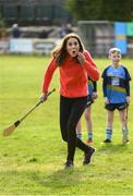 5 March 2020; Catherine, Duchess of Cambridge reacts after making an attempt to hit a sliothar with a hurley during an engagement at Salthill Knocknacarra GAA Club in Galway during day three of her visit to Ireland. Photo by Sam Barnes/Sportsfile