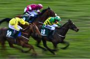 13 March 2020; Saint Roi, with Barry Geraghty up, green and yellow silks, races ahead of Embittered, with JJ Slevin up, top, and Buildmeupbuttercup, with Danny Mullins up, on their way to winning the Randox Health County Handicap Hurdle on Day Four of the Cheltenham Racing Festival at Prestbury Park in Cheltenham, England. Photo by David Fitzgerald/Sportsfile