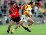 28 May 2000; Gearoid Adams, Antrim, in action against Shane Mulholland, Down. Down v Antrim, Ulster Senior Football Championship, Casement Park, Belfast. Photo by David Maher/Sportsfile