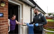 17 June 2020; Sean Owens, member of St. Canice’s GAA club in Dungiven, Derry, delivers a hot dinner to Bernie O’Neill, a member of the local community, as GAA clubs nationwide help out their local communities during restrictions imposed by the Irish and British Governments in an effort to contain the spread of the Coronavirus (COVID-19) pandemic. GAA facilities reopened on Monday June 8 for the first time since March 25 with club matches provisionally due to start on July 31 and intercounty matches due to to take place no sooner that October 17. Photo by Stephen McCarthy/Sportsfile