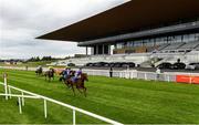 26 June 2020; A general view as Merchants Quay, right, with Wayne Lordan up, passes the post to win the Irish Stallion Farms EBF (C & G) Maiden during day one of the Dubai Duty Free Irish Derby Festival at The Curragh Racecourse in Kildare. Horse Racing continues behind closed doors following strict protocols having been suspended from March 25 due to the Irish Government's efforts to contain the spread of the Coronavirus (COVID-19) pandemic. Photo by Harry Murphy/Sportsfile