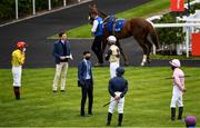 26 June 2020; Trainer Joseph O'Brien, second from left, and his brother Donnacha O'Brien, third from left, speak to the jockeys ahead of the Irish Stallion Farms EBF Fillies Maiden, during day one of the Dubai Duty Free Irish Derby Festival at The Curragh Racecourse in Kildare. Horse Racing continues behind closed doors following strict protocols having been suspended from March 25 due to the Irish Government's efforts to contain the spread of the Coronavirus (COVID-19) pandemic. Photo by Harry Murphy/Sportsfile