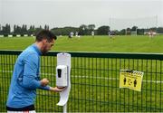 17 July 2020; Jervis Quinn of St Michael's sanitizes prior to the 2020 Down GAA ACFL Division 4B match between St Michael's and East Belfast at St Michael's GAA Ground in Magheralin, Down. Competitive GAA matches have been approved to return following the guidelines of Northern Ireland’s COVID-19 recovery plan and protocols set down by the GAA governing authorities. With games having been suspended since March, competitive games can take place with updated protocols with only players, officials and essential personnel permitted to attend, social distancing, hand sanitisation and face masks being worn by those in attendance in an effort to contain the spread of the Coronavirus (COVID-19) pandemic. Photo by David Fitzgerald/Sportsfile