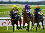 19 July 2020; Snowfall, centre, with Wayne Lordan up, races alongside eventual second place Sister Rosetta, left, with Colin Keane up, on their way to winning the Irish Stallion Farms EBF Fillies Maiden at The Curragh Racecourse in Kildare. Racing remains behind closed doors to the public under guidelines of the Irish Government in an effort to contain the spread of the Coronavirus (COVID-19) pandemic. Photo by Seb Daly/Sportsfile
