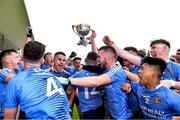 17 July 2020; St Joseph's SS players celebrate with the cup after the Leinster GAA Colleges Senior A Football Final match between Naas CBS and St Joseph's SS, Rochfortbridge at Bord na Móna O'Connor Park in Tullamore, Offaly. Competitive GAA matches have been approved to return following the guidelines of Phase 3 of the Irish Government’s Roadmap for Reopening of Society and Business and protocols set down by the GAA governing authorities. With games having been suspended since March, competitive games can take place with updated protocols including a limit of 200 individuals at any one outdoor event, including players, officials and a limited number of spectators, with social distancing, hand sanitisation and face masks being worn by those in attendance among other measures in an effort to contain the spread of the Coronavirus (COVID-19) pandemic. Photo by Piaras Ó Mídheach/Sportsfile