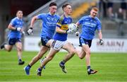 17 July 2020; Paddy McDermott of Naas CBS gets past Ciaran Daly, left, and Shane Fleming of St Joseph's SS during the Leinster GAA Colleges Senior A Football Final match between Naas CBS and St Joseph's SS, Rochfortbridge at Bord na Móna O'Connor Park in Tullamore, Offaly. Competitive GAA matches have been approved to return following the guidelines of Phase 3 of the Irish Government’s Roadmap for Reopening of Society and Business and protocols set down by the GAA governing authorities. With games having been suspended since March, competitive games can take place with updated protocols including a limit of 200 individuals at any one outdoor event, including players, officials and a limited number of spectators, with social distancing, hand sanitisation and face masks being worn by those in attendance among other measures in an effort to contain the spread of the Coronavirus (COVID-19) pandemic. Photo by Piaras Ó Mídheach/Sportsfile