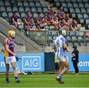 19 July 2020; Kilmacud Crokes substitutes watch on from the stands during the Dublin County Senior Hurling Championship Round 1 match between Ballyboden St Enda's and Kilmacud Crokes at Parnell Park in Dublin. Competitive GAA matches have been approved to return following the guidelines of Phase 3 of the Irish Government’s Roadmap for Reopening of Society and Business and protocols set down by the GAA governing authorities. With games having been suspended since March, competitive games can take place with updated protocols including a limit of 200 individuals at any one outdoor event, including players, officials and a limited number of spectators, with social distancing, hand sanitisation and face masks being worn by those in attendance among other measures in an effort to contain the spread of the Coronavirus (COVID-19) pandemic. Photo by Ramsey Cardy/Sportsfile