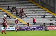 17 July 2020; Oulart the Ballagh substitutes sit in the stand during the Wexford County Senior Hurling Championship Group A Round 1 match between Oulart the Ballagh and St Martin's at Chadwicks Wexford Park in Wexford. Competitive GAA matches have been approved to return following the guidelines of Phase 3 of the Irish Government’s Roadmap for Reopening of Society and Business and protocols set down by the GAA governing authorities. With games having been suspended since March, competitive games can take place with updated protocols including a limit of 200 individuals at any one outdoor event, including players, officials and a limited number of spectators, with social distancing, hand sanitisation and face masks being worn by those in attendance among other measures in an effort to contain the spread of the Coronavirus (COVID-19) pandemic. Photo by Brendan Moran/Sportsfile