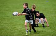 21 July 2020; 10 year old Odhrán Crossan, left, is tackled by 11 year old Alex Keogh during the Bank of Ireland Leinster Rugby Summer Camp at Longford RFC in Lisbrack, Longford. Photo by Ramsey Cardy/Sportsfile