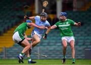 24 July 2020; Kevin Downes of Na Piarsaigh in action against Mark O'Loughlin, left, and Gavin O'Mahony of Kilmallock during the Limerick County Senior Hurling Championship Round 1 match between Kilmallock and Na Piarsaigh at LIT Gaelic Grounds in Limerick. GAA matches continue to take place in front of a limited number of people in an effort to contain the spread of the coronavirus (Covid-19) pandemic. Photo by Piaras Ó Mídheach/Sportsfile