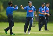 20 August 2020; Simi Singh of Leinster Lightning, left, is congratulated by team-mate Tyrone Kane after claiming the wicket of Jonathan Garth of Munster Reds during the 2020 Test Triangle Inter-Provincial Series match between Leinster Lightning and Munster Reds at Pembroke Cricket Club in Dublin. Photo by Seb Daly/Sportsfile