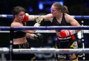 22 August 2020; Katie Taylor, left, takes a right from Delfine Persoon during their Undisputed Lightweight Titles fight at Brentwood in Essex, England. Photo by Mark Robinson / Matchroom Boxing via Sportsfile
