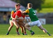 20 September 2020; Lee Brennan of Trillick St. Macartan’s is fouled by Mark McKearney, left, and David Walsh of Dungannon Thomas Clarkes during the Tyrone County Senior Football Championship Final match between Trillick St. Macartan’s and Dungannon Thomas Clarkes at Healy Park in Omagh, Tyrone. Photo by Ramsey Cardy/Sportsfile