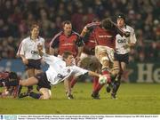 17 January 2004; Donnacha O'Callaghan, Munster, kicks through despite the attentions of Jon Goodridge, Gloucester. Heineken European Cup 2003-2004, Round 4, Pool 5, Munster v Gloucester, Thomond Park, Limerick. Picture credit; Brendan Moran / SPORTSFILE *EDI*