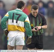 18 January 2004; Laois referee Maurice Deegan, who booked 11 players, takes the name of Offaly's John Hurst. O'Byrne Cup Semi-Final, Meath v Offaly, Pairc Tailteann, Navan, Co. Meath. Picture credit; Ray McManus / SPORTSFILE *EDI*