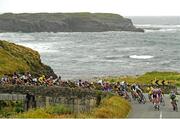 4 July 2013; A general view of the action as the peloton passes through Spanish Point during Stage 3 on the 2013 Junior Tour of Ireland, Ennis - Ennis, Co. Clare. Picture credit: Stephen McMahon / SPORTSFILE