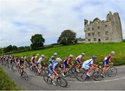 5 July 2013; A general view of the action as the peloton pass the ruins of Leamaneh Castle during Stage 4 of the 2013 Junior Tour of Ireland, Ennis - Ennis, Co. Clare. Picture credit: Stephen McMahon / SPORTSFILE