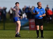 27 September 2020; Mark Whelan of Naomh Mairtin watches his kick for a point go over the bar with referee Paul Kneel during the Louth County Senior Football Championship Final match between Naomh Mairtin and Ardee St Mary’s at Darver Louth Centre of Excellence in Louth. Photo by Ben McShane/Sportsfile