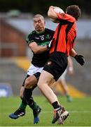 4 October 2020; Bart Daly of Duhallow is tackled by Barry O'Driscoll of Nemo Rangers during the Cork County Premier Senior Football Championship Semi-Final match between Nemo Rangers and Duhallow at Páirc Ui Rinn in Cork. Photo by Sam Barnes/Sportsfile