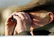 25 January 2004; Willie Smyth, from Birr, Co. Offaly, watches the match. Walsh Cup, Offaly v Laois, St. Brendan's Park, Birr, Co. Offaly. Picture credit; Damien Eagers / SPORTSFILE