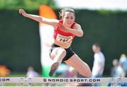 6 July 2013; Kate McGowan, Tir Chonaill AC, on her way to winning the Girl's U17 100m hurdles final during the Woodie’s DIY National Juvenile Track and Field Championships. Tullamore Harriers, Tullamore, Co. Offaly. Picture credit: Pat Murphy / SPORTSFILE