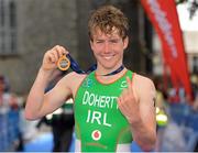 7 July 2013; Constantine Doherty, Ireland, celebrates after winning the 2013 Waterways Ireland Athlone ETU Triathlon Junior European Cup. Athlone, Co. Westmeath. Picture credit: Pat Murphy / SPORTSFILE