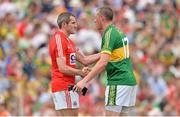 7 July 2013; Graham Canty, Cork, and Kieran Donaghy, Kerry, exchange a handshake after the game. Munster GAA Football Senior Championship Final, Kerry v Cork, Fitzgerald Stadium, Killarney, Co. Kerry. Picture credit: Diarmuid Greene / SPORTSFILE