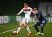 10 December 2020; John Mountney of Dundalk in action against Emile Smith-Rowe of Arsenal during the UEFA Europa League Group B match between Dundalk and Arsenal at the Aviva Stadium in Dublin. Photo by Stephen McCarthy/Sportsfile