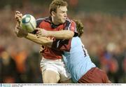 31 January 2004; John Kelly, Munster, is tackled by Kevin Zhakata, Bourgoin. Heineken European Cup 2003-2004, Pool 5, Round 6, Munster v Bourgoin, Thomond Park, Limerick. Picture credit; Matt Browne / SPORTSFILE *EDI*