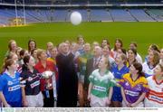 2 February 2004; An Taoiseach Bertie Ahern, T.D with Niall O'Gorman, right, General Manager of Suzuki Ireland, and Geraldine Giles, left, President of the Ladies Gaelic Football Association, with players from various counties at the launch of the 2004 Suzuki Ladies National Football League, Croke Park, Dublin. Picture credit; David Maher / SPORTSFILE *EDI*