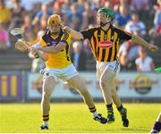 10 July 2013; Rhys Clarke, Wexford, in action against Pat Carroll, Kilkenny. Bord Gáis Energy Leinster GAA Hurling Under 21 Championship Final, Kilkenny v Wexford, Wexford Park, Wexford. Picture credit: Matt Browne / SPORTSFILE