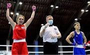 26 February 2021; Angelina Lukas of Kazakhstan, left, is declared victorious over Lacramioara Perijoc of Romania during their women's flyweight 51kg semi-final bout at the AIBA Strandja Memorial Boxing Tournament in Sofia, Bulgaria. Photo by Alex Nicodim/Sportsfile