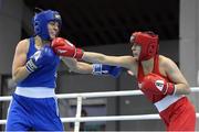 26 February 2021; Navbakhor Khamidova of Uzbekistan, left, in action against Anna Lysenko of Ukriane during their Women's Welterweight 69kg semi-final bout at the AIBA Strandja Memorial Boxing Tournament in Sofia, Bulgaria. Photo by Alex Nicodim/Sportsfile