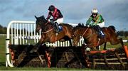 11 March 2021; Toms Courage, with Martin Burke up, left, jump the last alongside Danegeld, with Mike O'Connor, who eventually won third place, on their way to winning the Killinan Handicap hurdle at Thurles Racecourse in Tipperary. Photo by David Fitzgerald/Sportsfile