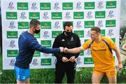 10 April 2021; Leinster captain Jonathan Sexton and Exeter Chiefs captain Joe Simmonds fist bump with Referee Mathieu Raynal at the coin toss before the Heineken Champions Cup Pool Quarter-Final match between Exeter Chiefs and Leinster at Sandy Park in Exeter, England. Photo by Ramsey Cardy/Sportsfile