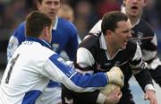 8 February 2004; Dessie Sloyan, Sligo, is tackled by Laois, goalkeeper Fergal Byron. Allianz National Football League, Division 1B, Laois v Sligo, O'Moore Park, Portlaoise, Co. Laois. Picture credit; Matt Browne / SPORTSFILE *EDI*