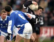 8 February 2004; Brian Curran, Sligo, is tackled by Tom Kelly, Laois. Allianz National Football League, Division 1B, Laois v Sligo, O'Moore Park, Portlaoise, Co. Laois. Picture credit; Matt Browne / SPORTSFILE *EDI*