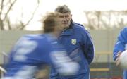 8 February 2004; Laois manager Mick O'Dwyer watches his players warm up before the start of the game against Sligo. Allianz National Football League, Division 1B, Laois v Sligo, O'Moore Park, Portlaoise, Co. Laois. Picture credit; Matt Browne / SPORTSFILE *EDI*