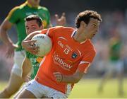 13 July 2013; Jamie Clarke, Armagh, in action against Danny Beck,  Leitrim. GAA Football All-Ireland Senior Championship, Round 2, Leitrim v Armagh, Pairc Sean Mac Diarmada, Carrick-on-Shannon, Co. Leitrim. Picture credit: Oliver McVeigh / SPORTSFILE