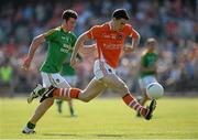 13 July 2013; Caolan Rafferty, Armagh, in action against Barry Prior,  Leitrim. GAA Football All-Ireland Senior Championship, Round 2, Leitrim v Armagh, Pairc Sean Mac Diarmada, Carrick-on-Shannon, Co. Leitrim. Picture credit: Oliver McVeigh / SPORTSFILE