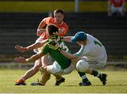 13 July 2013; Eugene McVerry, Armagh, shoots to score his side's fourth goal despite the efforts of Ciaran Egan and Cathal McCrann, right, Leitrim. GAA Football All-Ireland Senior Championship, Round 2, Leitrim v Armagh, Pairc Sean Mac Diarmada, Carrick-on-Shannon, Co. Leitrim. Picture credit: Oliver McVeigh / SPORTSFILE