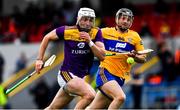 16 May 2021; Rory O'Connor of Wexford and Jack Browne of Clare in a race for possession during the Allianz Hurling League Division 1 Group B Round 2 match between Clare and Wexford at Cusack Park in Ennis, Clare. Photo by Ray McManus/Sportsfile