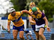 16 May 2021; Matthew O'Hanlon of Wexford is tackled by Aaron Shanagher of Clare during the Allianz Hurling League Division 1 Group B Round 2 match between Clare and Wexford at Cusack Park in Ennis, Clare. Photo by Ray McManus/Sportsfile