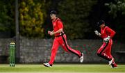 22 May 2021; Jack Carty, left, and PJ Moor of Munster Reds celebrate the wicket of Andy Balbirnie of Leinster Lighting during the Cricket Ireland InterProvincial Cup 2021 match between Munster Reds and Leinster Lightning at Pembroke Cricket Club in Dublin. Photo by Harry Murphy/Sportsfile