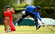 22 May 2021; Tyrone Kane of Munster Reds attempts to run out David O'Halloran of Leinster Lighting during the Cricket Ireland InterProvincial Cup 2021 match between Munster Reds and Leinster Lightning at Pembroke Cricket Club in Dublin. Photo by Harry Murphy/Sportsfile