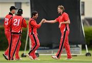 22 May 2021; Tyrone Kane of Munster Reds celebrates with team-mate Joshya Manley after catching out Barry McCarthy of Leinster Lighting during the Cricket Ireland InterProvincial Cup 2021 match between Munster Reds and Leinster Lightning at Pembroke Cricket Club in Dublin. Photo by Harry Murphy/Sportsfile