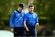 22 May 2021; George Dockrell, left, speaks with Josh Little of Leinster Lighting during the Cricket Ireland InterProvincial Cup 2021 match between Munster Reds and Leinster Lightning at Pembroke Cricket Club in Dublin. Photo by Harry Murphy/Sportsfile