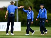 22 May 2021; David O'Halloran of Leinster Lighting celebrates with team-mate Simi Singh after bowling out Jack Carty of Munster Reds during the Cricket Ireland InterProvincial Cup 2021 match between Munster Reds and Leinster Lightning at Pembroke Cricket Club in Dublin. Photo by Harry Murphy/Sportsfile