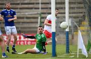 29 May 2021; Niall Loughlin of Derry shoots to score his side's first goal past Cavan goalkeeper Raymond Galligan during the Allianz Football League Division 3 North Round 3 match between Cavan and Derry at Kingspan Breffni in Cavan. Photo by Harry Murphy/Sportsfile